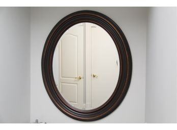 A Farmhouse Wooden Oval Mirror By Uttermost