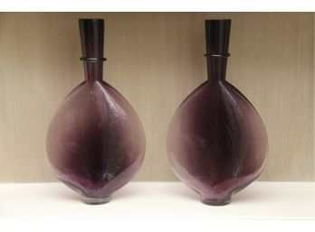 A Set Of Matching Designer Purple Vessels