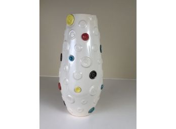 A Ceramic Vase With Button Theme