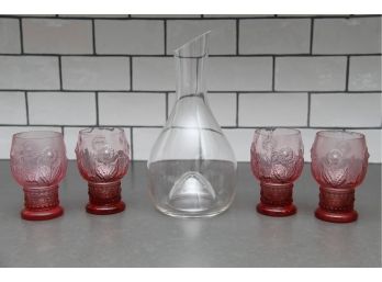 A Decanter And 4 Pink Glasses  From Anthropology