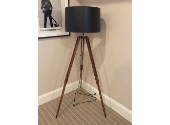 A Modern 3 Leg Floor Lamp With Black Shade