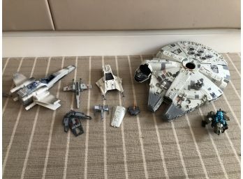 A Collection Of Vintage Star Wars Ships Including The Millennium Falcon