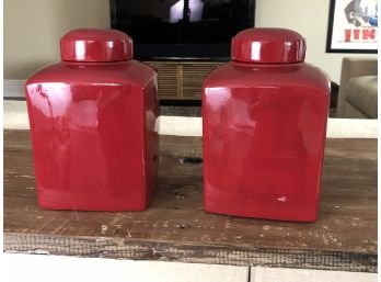 A Pair Of Red Covered Ceramic Jars
