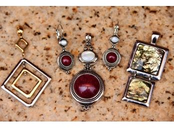 A Group Of Lia Sophia Earrings Featuring Faux Red Stone Center And Gold And Silver Colored Pendants