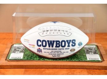 A Dallas Cowboy NFL Football With Official Cowboy/jets Game Tickets