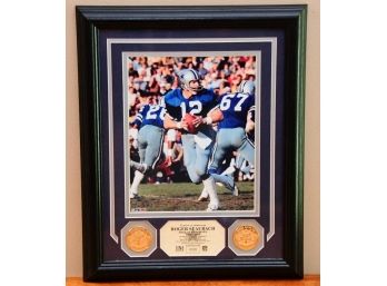 A Framed Roger Staubach Photo With 2 Gold NFL Medallions
