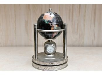 A Globe With A Spinning Base And Hygrometer