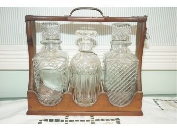 Trio Of Whiskey Decanters In Wood Hand Basket