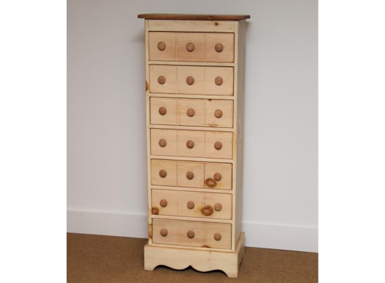 A Thin Natural Pine Chest Of Drawers