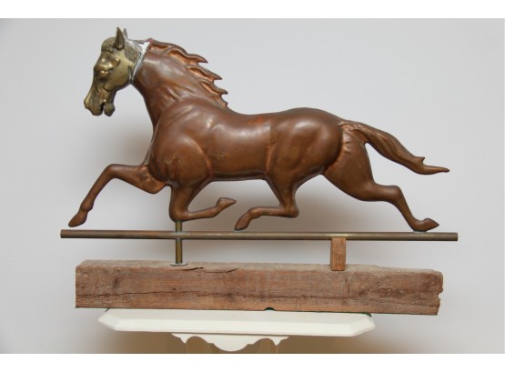 A Copper Horse Wind Vane With Brass Horse Head