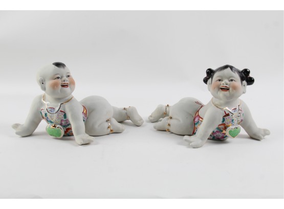 Pair Of Porcelain Asian Baby Statues