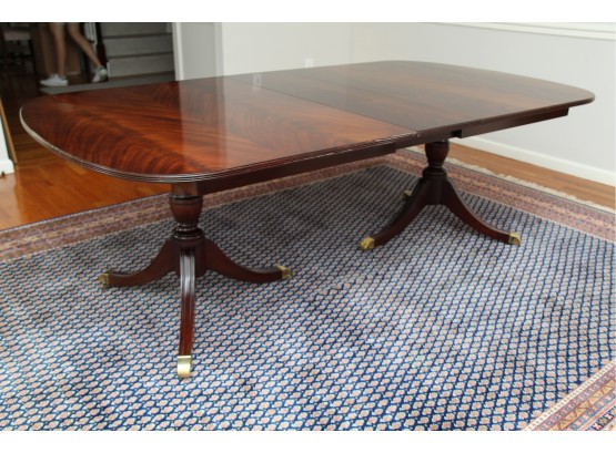 A Dual Pedestal Flame Mahogany Dining Table