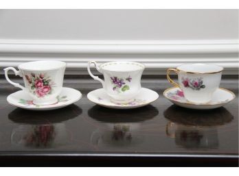 A Collection Of  Three Tea Cups And Saucers