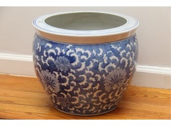 A Blue And White Fishbowl Planter