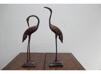 A Pair Of Metal Cranes