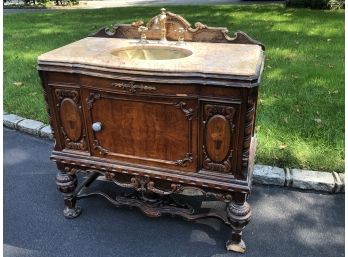 An Antique Sink Cabinet With Marble Top Brass Sink And Hardware