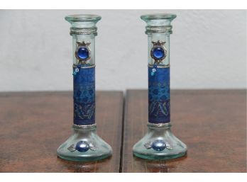 A Pair Of Glass Candlesticks With Deep Blue Accents