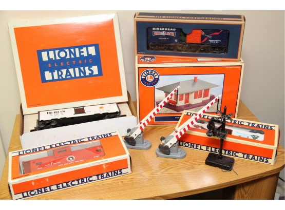 Set Of 4 Lionel Trains With Additional Passenger Station & Rail Crossing Signs