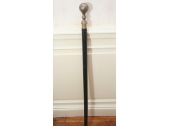 A Metal Etched Sphere Top Walking Stick In Black