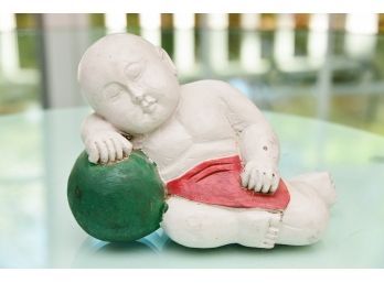 A Chinese Carved Wood Baby Figurine
