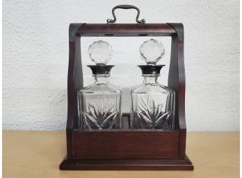 A Pair Of Crystal Decanters With Sterling Tops