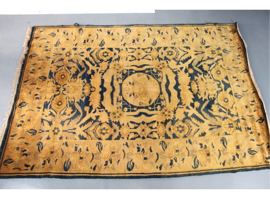 A Black And Gold Wool Rug From India