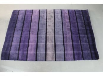 A Hand Loom Purple Wool Rug Made In India