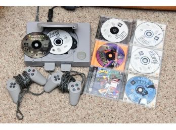 PS1 With Controllers Wires And Games