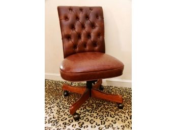 A Leather Button Tufted Rolling Desk Chair