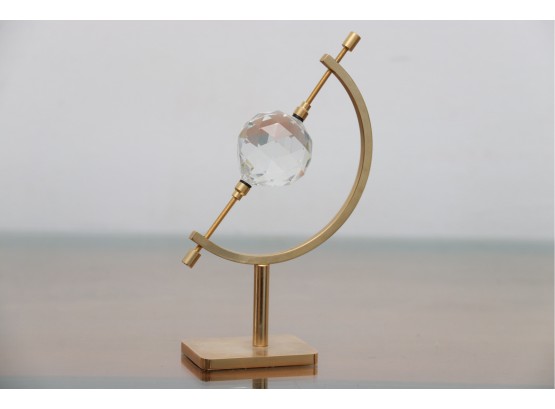 Brass Caliper Holding A Swarovski Crystal Ball