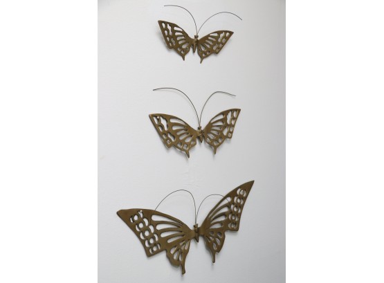 A Set Of 3 Brass Butterfly Wall Hangings