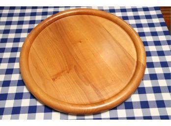 A Large Round Wood Platter Made In Italy
