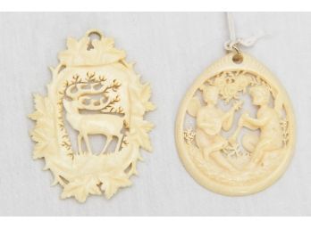 A Pair Of Hand Carved Bone Pendants