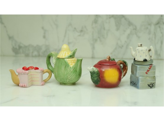 Four Miniature Hand Painted Tea Pots