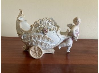 Painted Porcelain Cherub Pulling Chariot