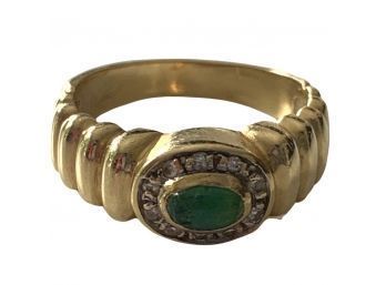 Gold Colored Ring With Green Gemstone