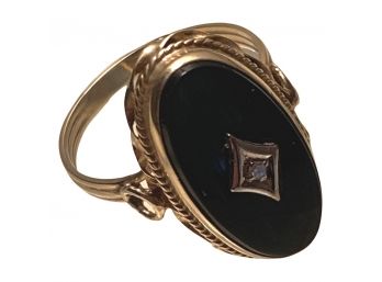 Gold Toned Ring With Black Gemstone