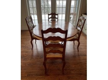 Farmhouse Extension Table With Distressed White Base And 4 Solid Wood Ladder Back Wicker Chairs