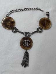 Fashion Bracelet With Chanel CC Logo, Rhinestones, Gunmetal Toned Links And Tassle