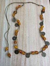 Amber Colored Bead And Brass Colored Chinese Token Adjustable Length Cord Fashion Necklace