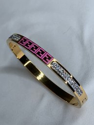Gold Toned Bangle Bracelet With Fendi F Pattern In Pink Enamel, With Double Row Of Rhinestones On Each Side