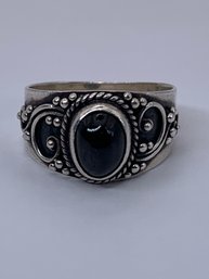 Smooth Rounded Oval Black Inlaid Stone, Sterling Silver Ring With Twisted And Scrolling Filigree Design