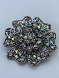 Decorative AB Rhinestone Flower Brooch, Silver Toned Twisted Robe And Open Work Filigree Design, 1.75 Inches