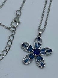 Open Petal Silver Toned  Flower Pendant With Round And Emerald Cut Blue Rhinestones, Necklace Is 18 Inches