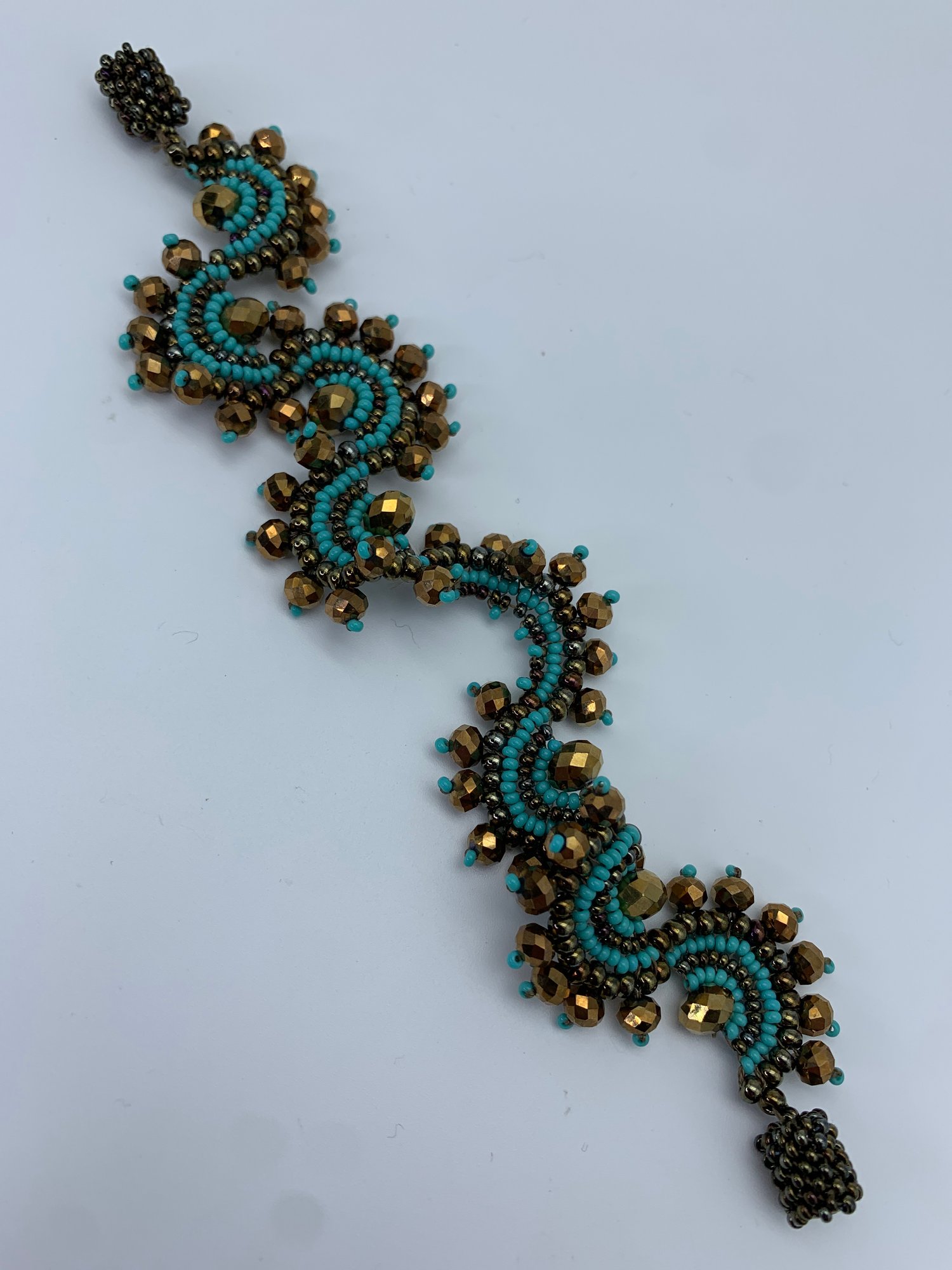 Magnetic Clasp Hand Stitched Bead Bracelet In Turquoise And Metallic