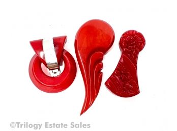 Red Bakelite Dress Clips