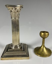 A Danish Modern Brass Candlestick And A Silver Metal Roman Column Candlestick