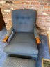 A Quality Upholstered Arm Chair With Matching Ottoman & Carved Arms