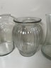 A Grouping Of 4 Clear Glass Vases & Planters
