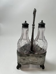 Pair Of Glass Cruets With A Metal Base / Carrier